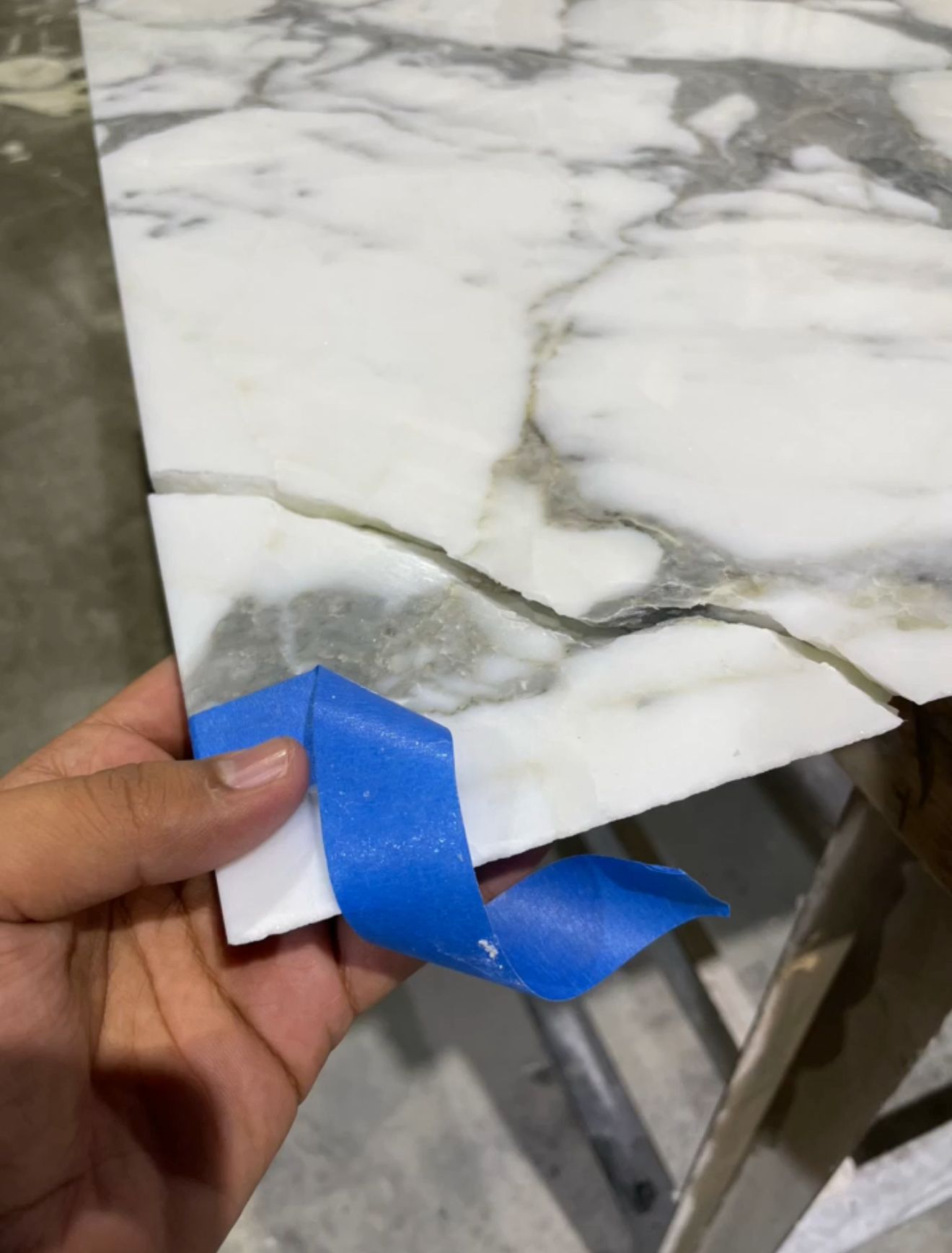 Damaged stone surface before repair